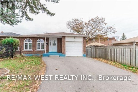 A house with a blue door and a white garage door is for sale.