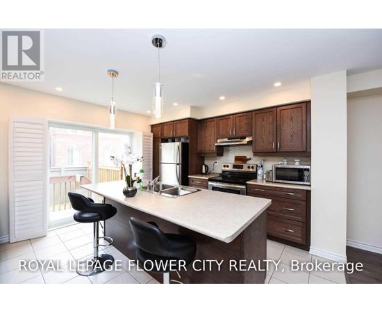 A kitchen with a counter and a microwave on it.