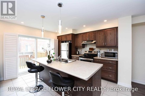 A kitchen with a counter and a microwave on it.