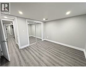 A room with a realtor sign on the wall.