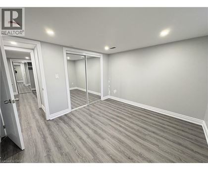 A room with a realtor sign on the wall.