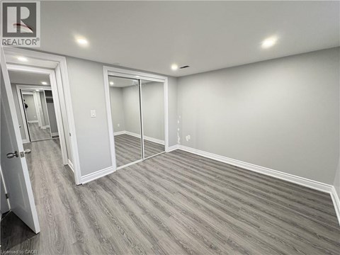 A room with a realtor sign on the wall.