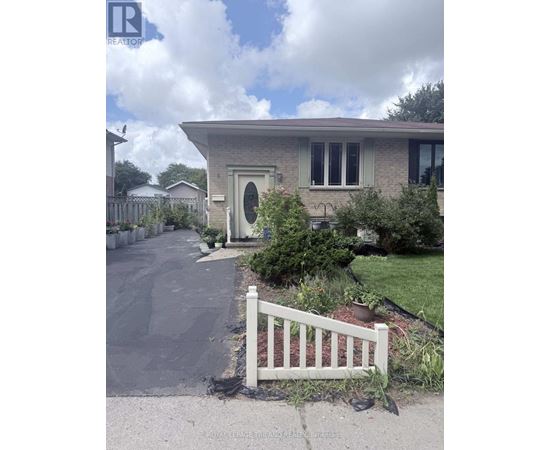 A house with a white fence in front of it.