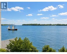 A boat with three sails is on a body of water.