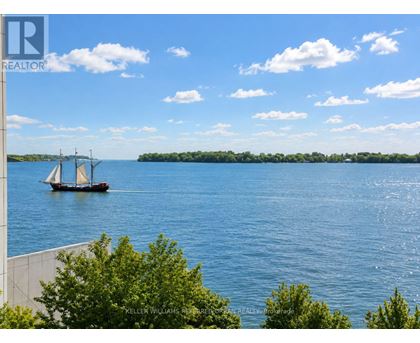 A boat with three sails is on a body of water.