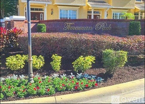 A sign that says "Twinlawn Parks" in front of a building.