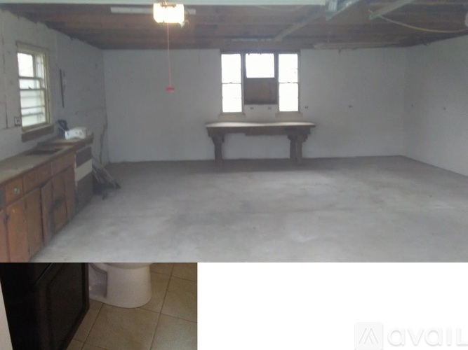 A room with a table and a window.