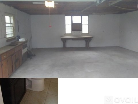 A room with a table and a window.