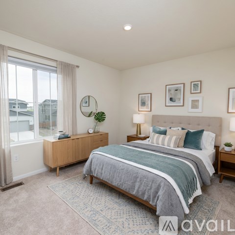 A bedroom with a large bed and a wooden dresser.