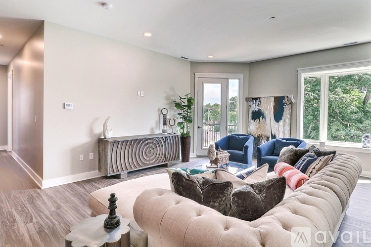 A living room with a large couch and a coffee table.