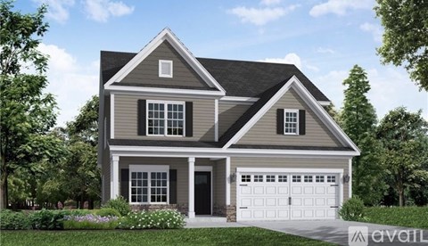 A two-story house with a garage is available for purchase.