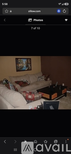 A living room with a couch and a coffee table.