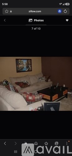 A living room with a couch and a coffee table.