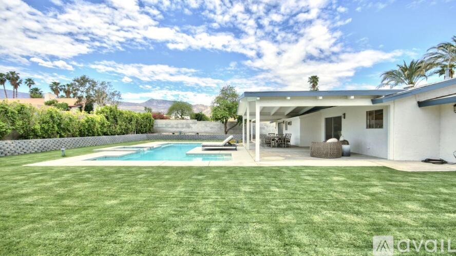 A house with a pool in the backyard.