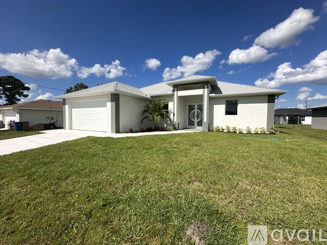 A house with a white garage door is for sale.