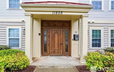 The front door of a house with the number 11808 on it.