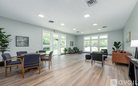 A living room with wooden floors and furniture.