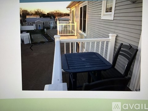A patio with a table and chairs is available for rent.