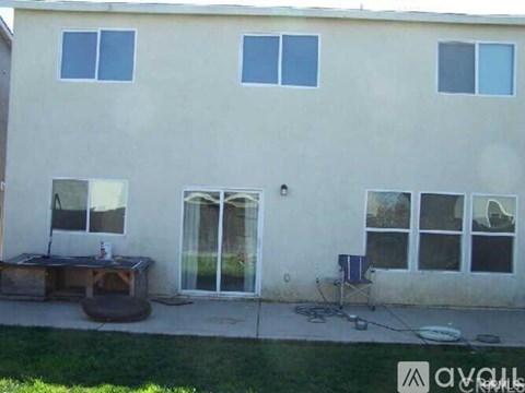 A house with a patio and a table.