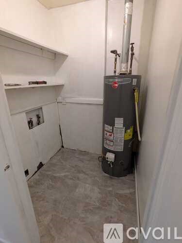A room with a floor heater and a wall heater.