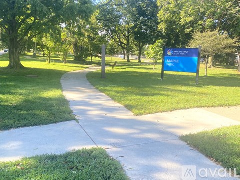 A sign in a park reads "Amaple".