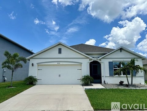 A house with a white garage door is for sale.