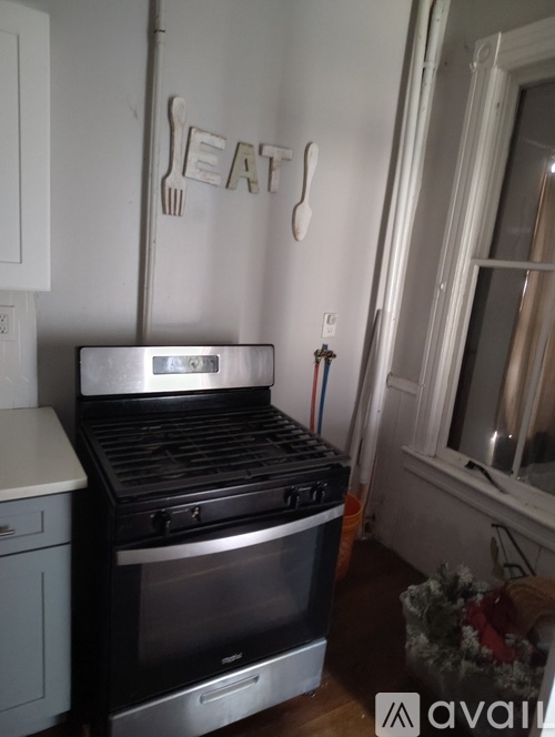 A stove top oven with a silver finish and a black stove top.
