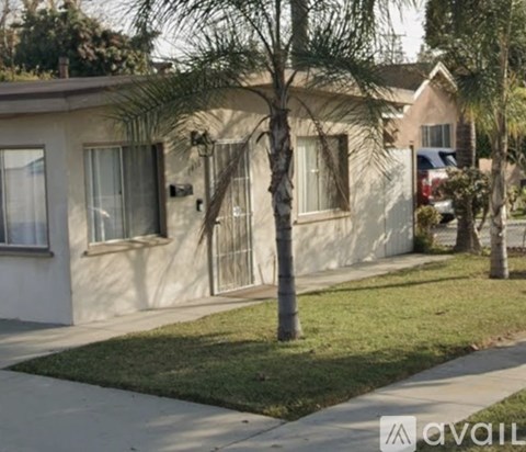 A house with a tree in front of it.