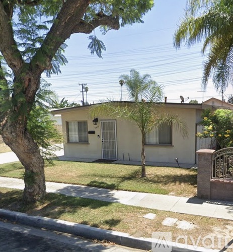 A house with a tree in front of it.