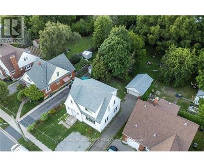 A bird's eye view of a residential area with houses and trees.