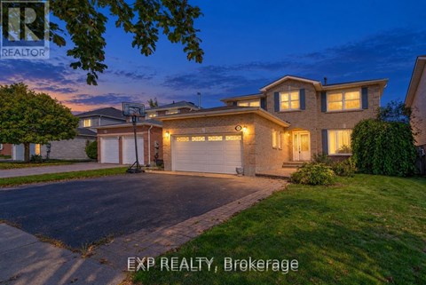 A house with a driveway and garage is shown in the image.