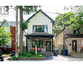 A house with a front yard and a sign that says Bosley Real Estate LTD.