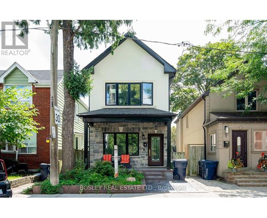A house with a front yard and a sign that says Bosley Real Estate LTD.