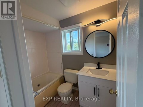 A bathroom with EXP Realty, Brokerage written on the bottom.