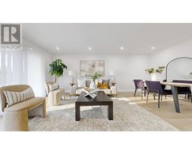 A modern living room with a coffee table, couches, and a potted plant.