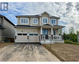 A two-story house with a garage is for sale.