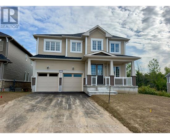 A two-story house with a garage is for sale.