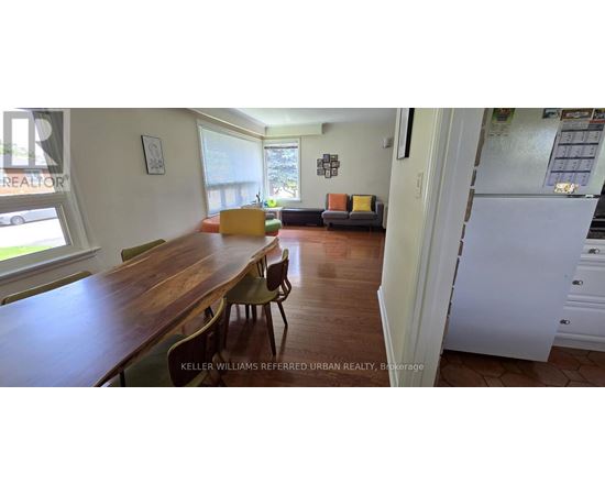 A kitchen with a table and chairs in the middle of the room.