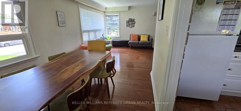 A kitchen with a table and chairs in the middle of the room.