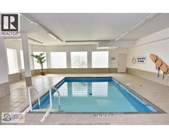 A large indoor swimming pool with a depth of 4 feet.