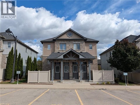A building with a grey front and a sign that says REALTOR.