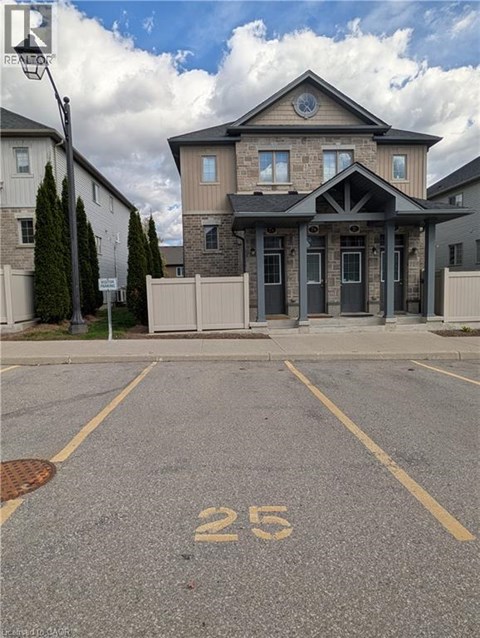 A house with the number 25 painted on the parking lot.
