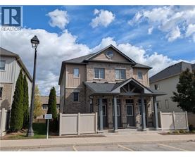 A house with a sign that says REALTOR in front of it.