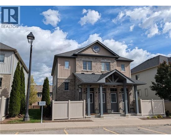 A house with a sign that says REALTOR in front of it.