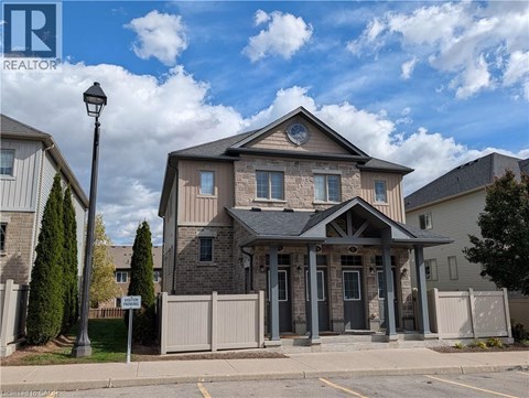 A house with a sign that says REALTOR in front of it.