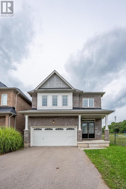 A two-story house with a garage is shown in the image.