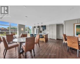A modern dining room with a glass table and chairs.