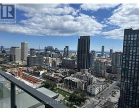 A cityscape with a view of the sky and buildings from a high vantage point.