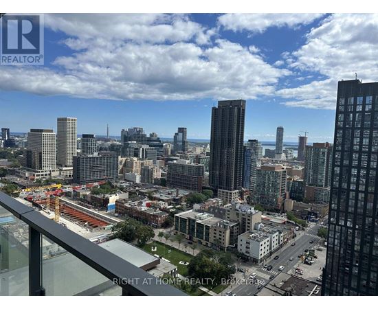 A cityscape with a view of the sky and buildings from a high vantage point.