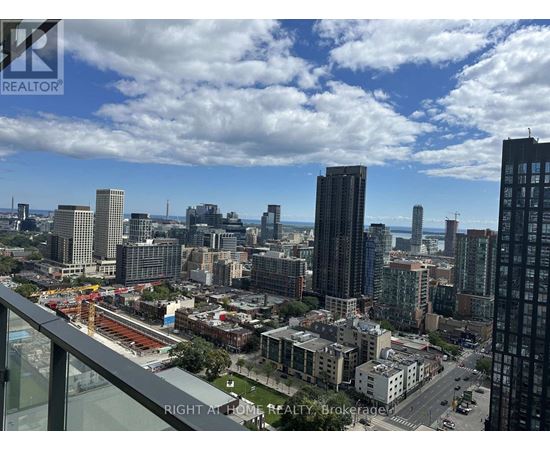 A cityscape with a clear sky and buildings of various heights.